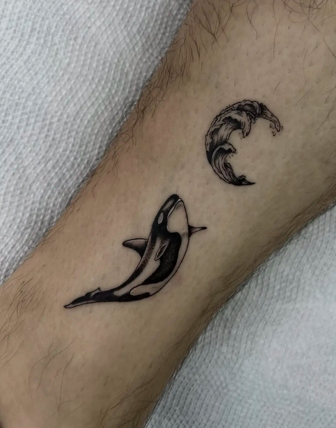 Whale and wave tattoo by Randy.